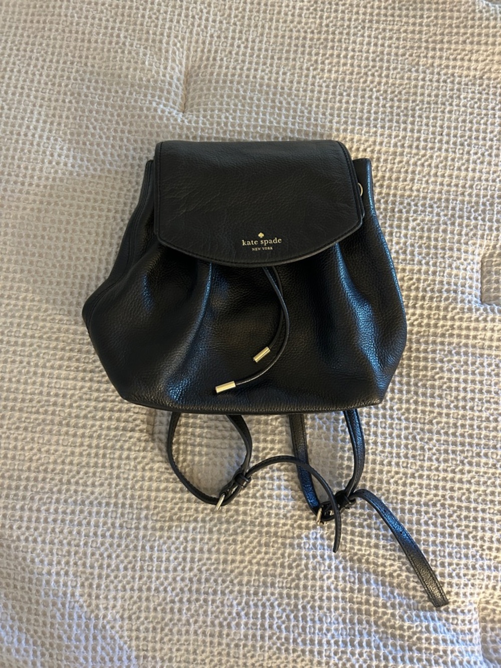 kate spade Black Pebbled Leather Drawstring Flap Backpack